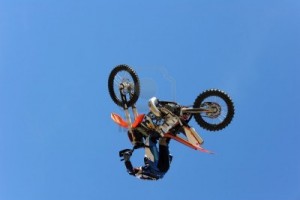 9632409-a-dirt-bike-rider-gets-air-during-a-stunt